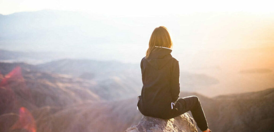 girl-at-top-of-mountain